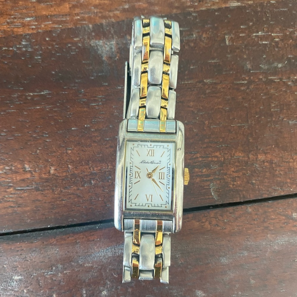Women’s Eddie Bauer silver and gold watch.  Works just needs new battery